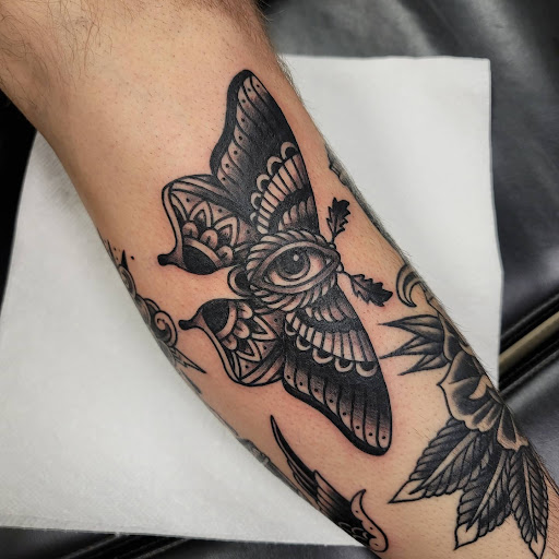 Explore black heart heart tattoo cover up ideas, creative tattoo ideas in Painesville, available at The Inkwell Tattoo Company