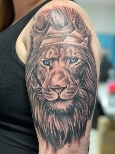 Explore tattoo ideas for weightlifters, creative tattoo ideas in Daytona Beach, available at Studio 21 Tattoo & Piercings Daytona Beach
