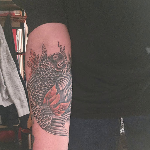 Explore vertical tattoo ideas, creative tattoo ideas in Lansing, available at Ink & Needle South