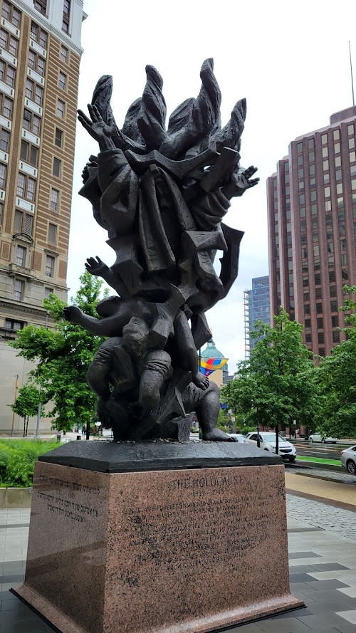  alt='Nice small park with sitting areas and Holocaust memorial. You will randomly see homeless person(s) and they will'