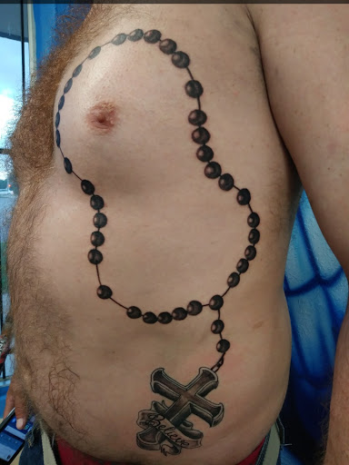 Explore heart and rose tattoo ideas, creative tattoo ideas in Houston, available at Orlandos Tattoo Studio