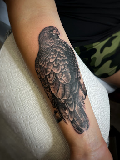 Explore bicep tattoo ideas for men, creative tattoo ideas in Lawrence, available at Black Chapel Tattoo