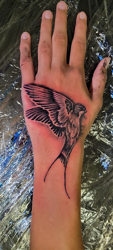 Explore neck and shoulder tattoo ideas, creative tattoo ideas in Angola, available at Hoodlum Ink