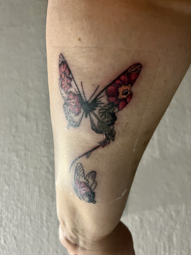 Explore female throat tattoo ideas, creative tattoo ideas in Buffalo, available at East Coast Ink