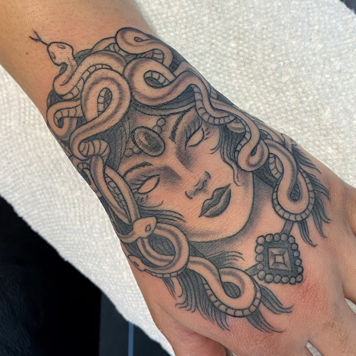 Find tattoo ideas on leg for your next unique tattoo in Raleigh at Raleigh Tattoo Company