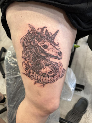 Explore red hand tattoo ideas, creative tattoo ideas in Cocoa, available at Rorschach Tattoo Shop and Piercing Studio