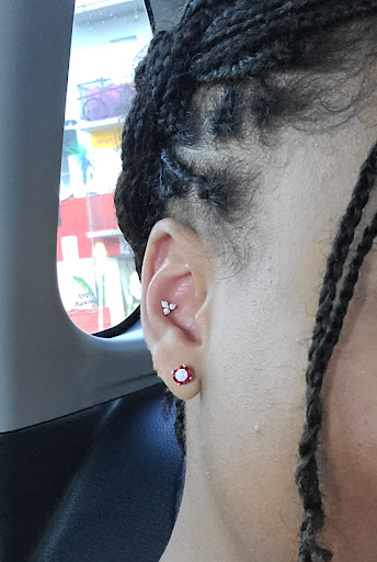 Explore dominican flag tattoo ideas, creative tattoo ideas in Miami, available at STUDS Miami Wynwood