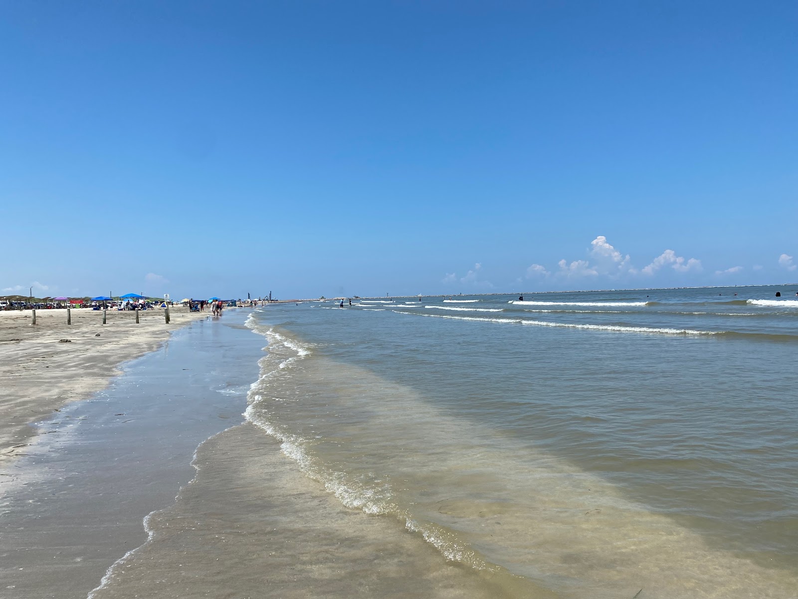 Photo of Port Aransas beach with turquoise pure water surface