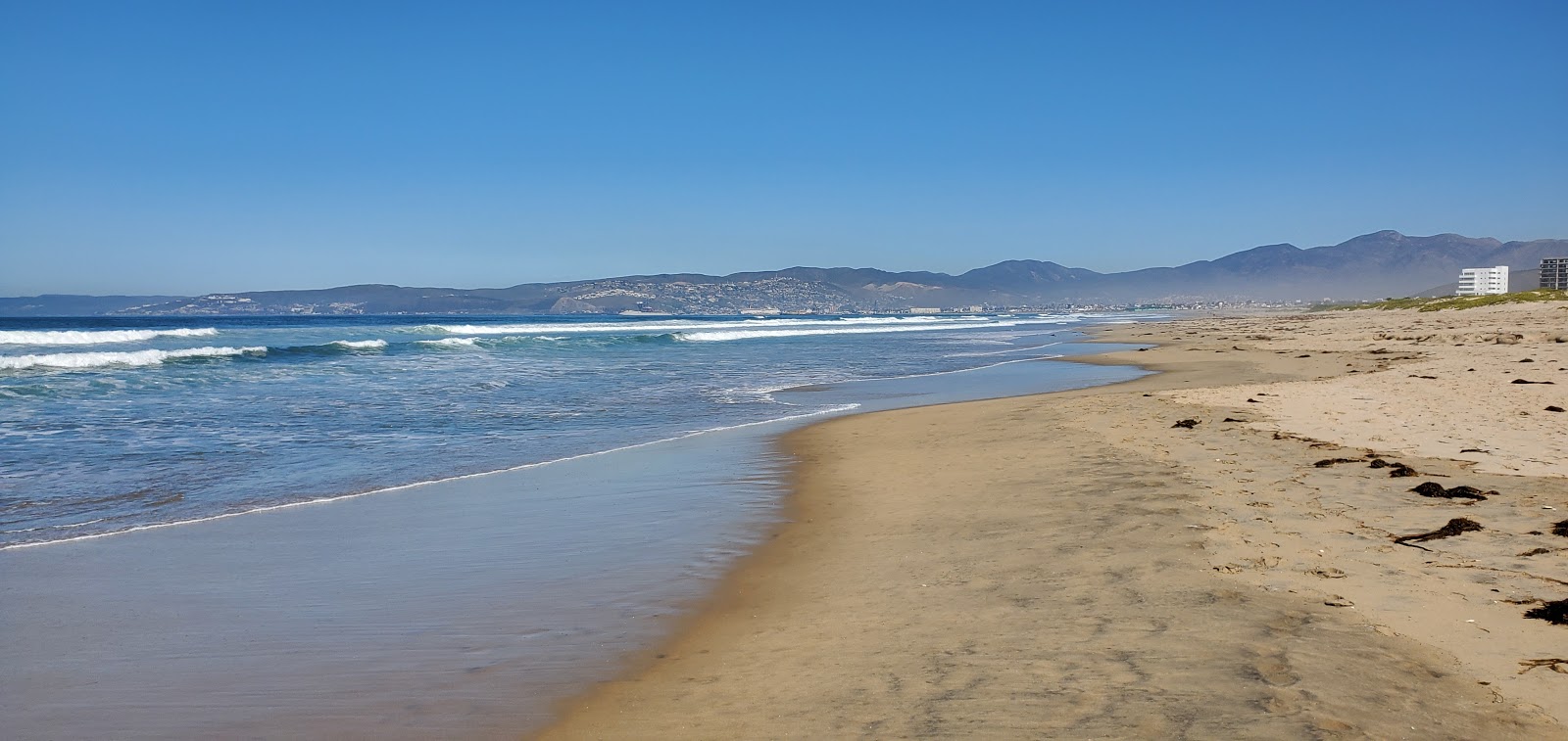 Foto av Playa Guarnicion Militar med lång rak strand