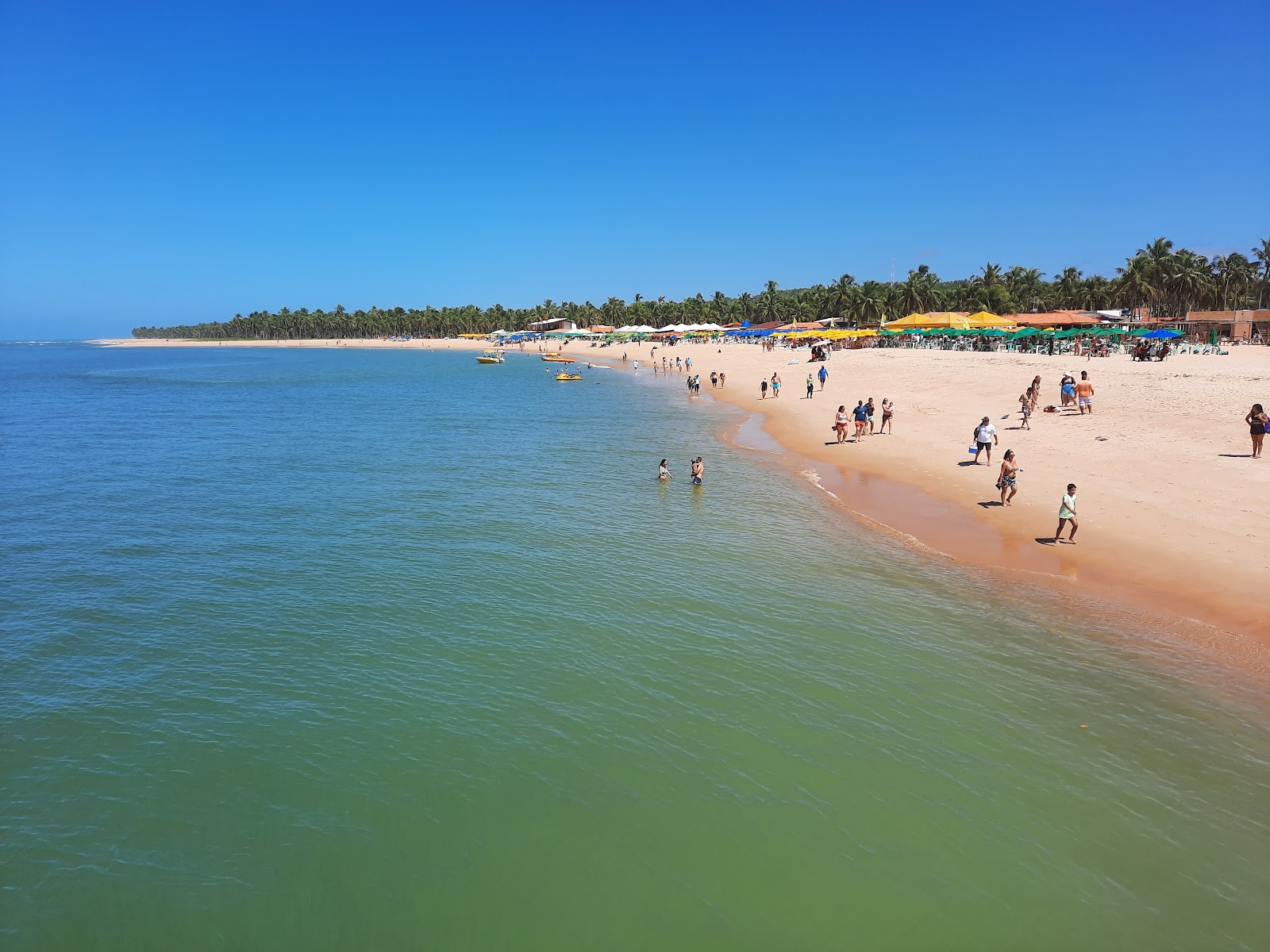 Foto de Playa Gunga con arena beige superficie