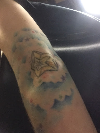 Explore reading tattoo ideas, creative tattoo ideas in Sturgis, available at Wayward Tattoo