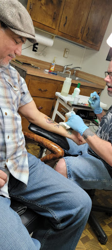 Explore cover up tattoo ideas on thigh, creative tattoo ideas in Marion, available at Eternal Art Tattooing