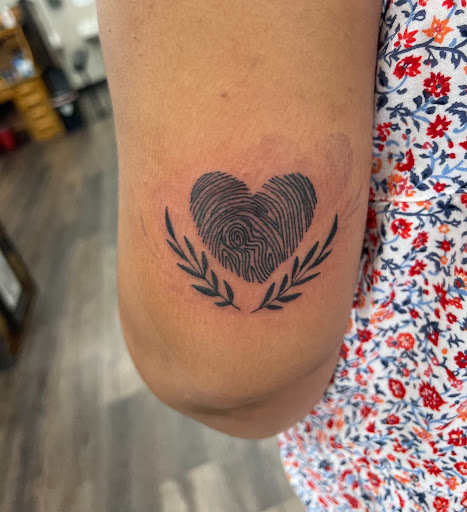 Explore blue rose tattoo ideas, creative tattoo ideas in Dayton, available at 33 Lions Tattoo