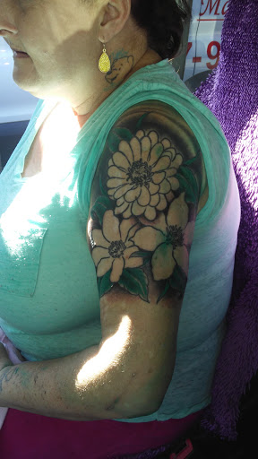 Explore women's arm tattoo ideas, creative tattoo ideas in Jessup, available at Savage Ink Tattoo Studio