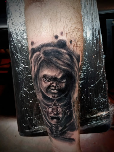 Explore kiss tattoo ideas, creative tattoo ideas in Girard, available at Cult Tattoo