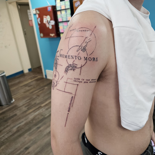 Explore iris flower tattoo ideas, creative tattoo ideas in Traverse City, available at Pinups & Needles