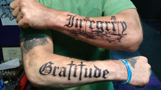 Explore rib tattoos for men ideas, creative tattoo ideas in Minneapolis, available at Mafia Ink Tattoo Studio
