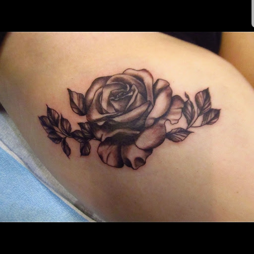 Explore thigh tattoo ideas for women, creative tattoo ideas in Abington, available at Ink Boss Tattoo & Piercing Studio