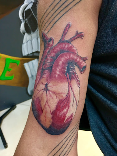 Explore ear tattoo ideas for women, creative tattoo ideas in Cape Coral, available at The Tattoo Emporium