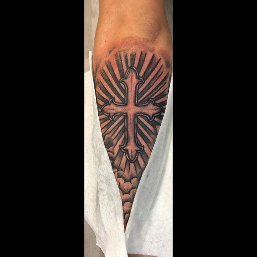 Explore cover up tattoo ideas for forearm, creative tattoo ideas in Londonderry, available at Billy Goat Tattoo