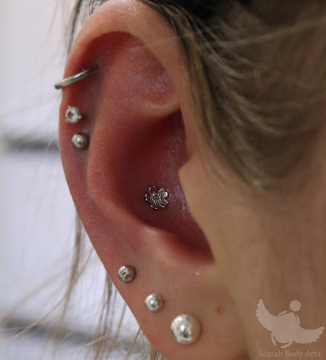Explore inside ear tattoos ideas, creative tattoo ideas in Syracuse, available at Scarab Body Arts