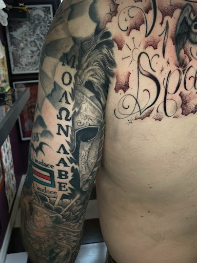 Explore wolf neck tattoo ideas, creative tattoo ideas in Georgetown, available at Iron Rite Tattoo South