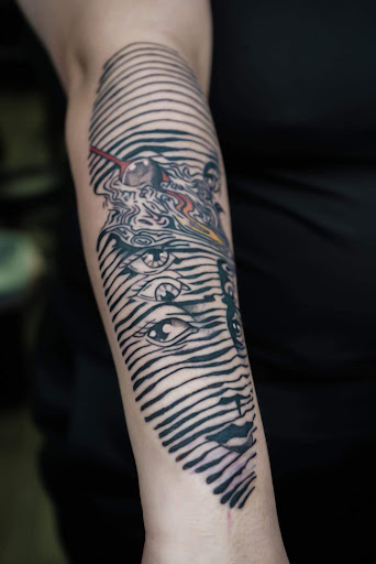 Explore rock tattoo ideas, creative tattoo ideas in Schaumburg, available at Urban Rebels Ink