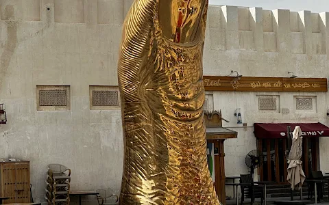 The Golden Thumb Statue image