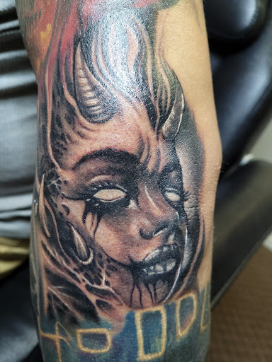 Explore top of foot tattoo ideas, creative tattoo ideas in Angola, available at Hoodlum Ink