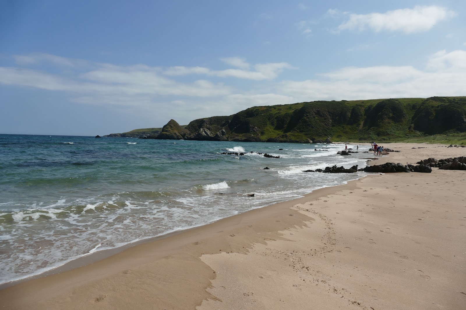 Foto von Sunnyside Beach mit heller feiner sand Oberfläche