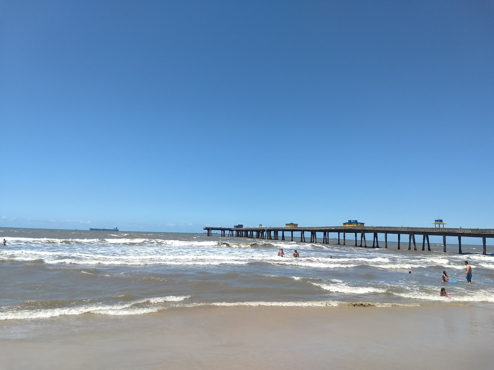 Praia de Tramandai'in fotoğrafı düz ve uzun ile birlikte