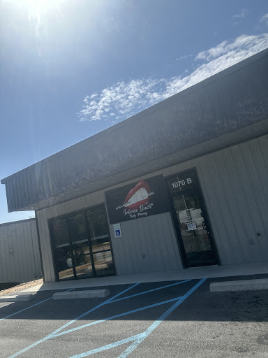 Explore rib tattoo ideas for women, creative tattoo ideas in Greenwood, available at Intense Pinch Body Piercing