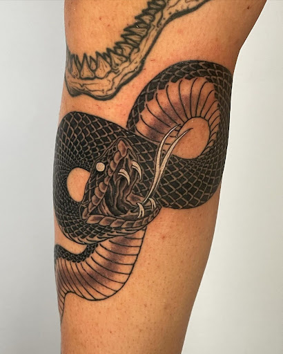 Explore tricep tattoo ideas for guys, creative tattoo ideas in Kissimmee, available at Fallen Sparrow Tattoo Co