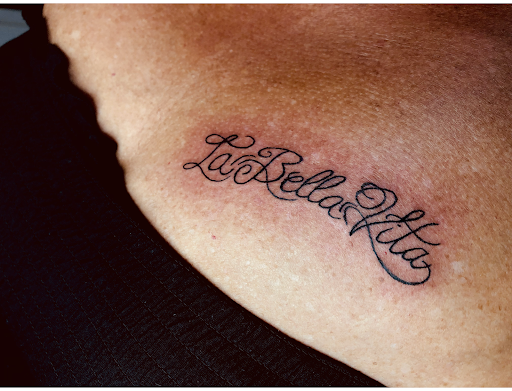 Explore dog paw tattoo ideas, creative tattoo ideas in North Tonawanda, available at Dark Side Ink Tattoo Studio