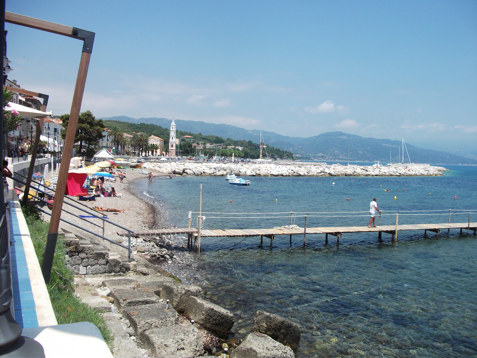 Photo of Port of Scario beach II with gray sand &  pebble surface