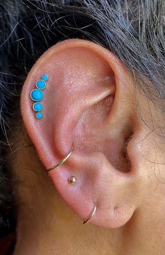 Explore small flower tattoo ideas, creative tattoo ideas in Worcester, available at Elegance Piercing & Tattoo Inc.