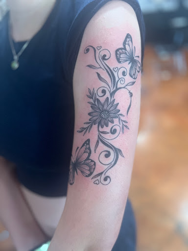 Explore kiss band tattoo ideas, creative tattoo ideas in Coeur D Alene, available at Jojos Tattoo & Body Piercing
