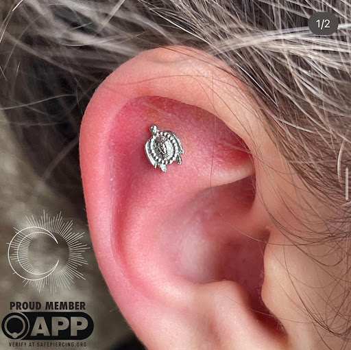 Explore tattoo ideas for female thigh, creative tattoo ideas in Appleton, available at Celestial Piercing- Inside of Big Guns Tattoo