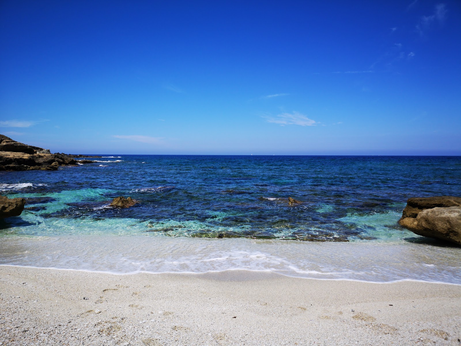 Cala Unia Beach'in fotoğrafı doğal alan içinde bulunmaktadır