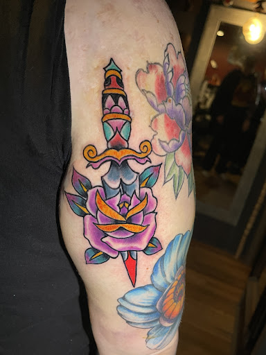 Explore lower back tattoo cover up ideas, creative tattoo ideas in Scranton, available at Tried N True Tattoo
