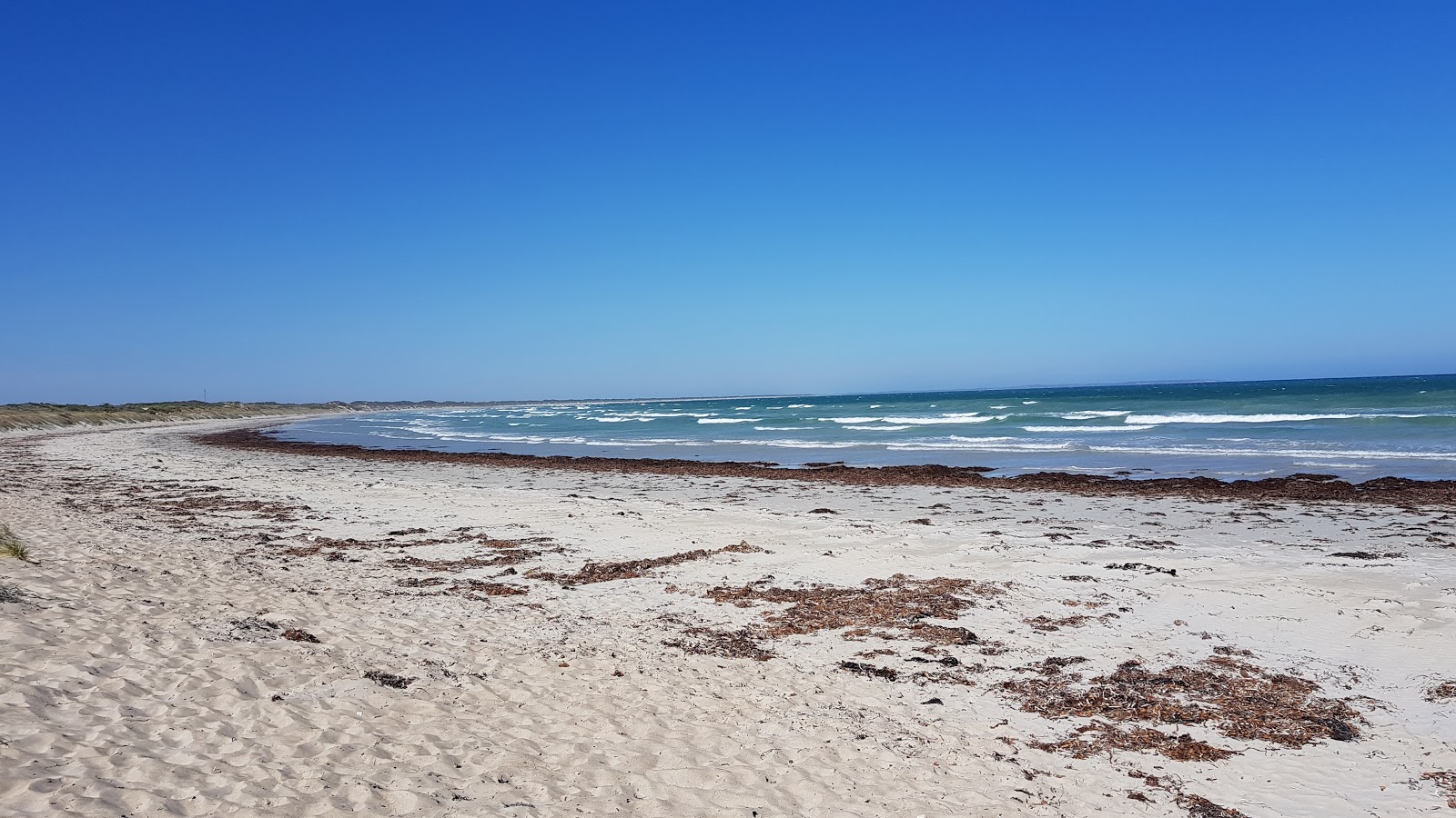Fotografija Surf Beach z svetel pesek površino