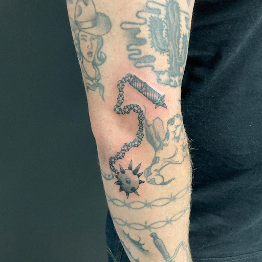 Explore tattoo ideas for guys shoulder, creative tattoo ideas in Cadillac, available at Limitless Ink Tattoo Studio