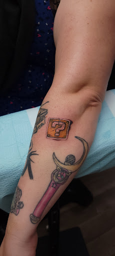 Explore tattoos for your son ideas, creative tattoo ideas in Largo, available at Alchemy Tattoos and Body Piercings