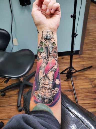 Find tattoo ideas for under the breast for your next unique tattoo in Calhoun at A Sailors Grave Tattoo Parlor