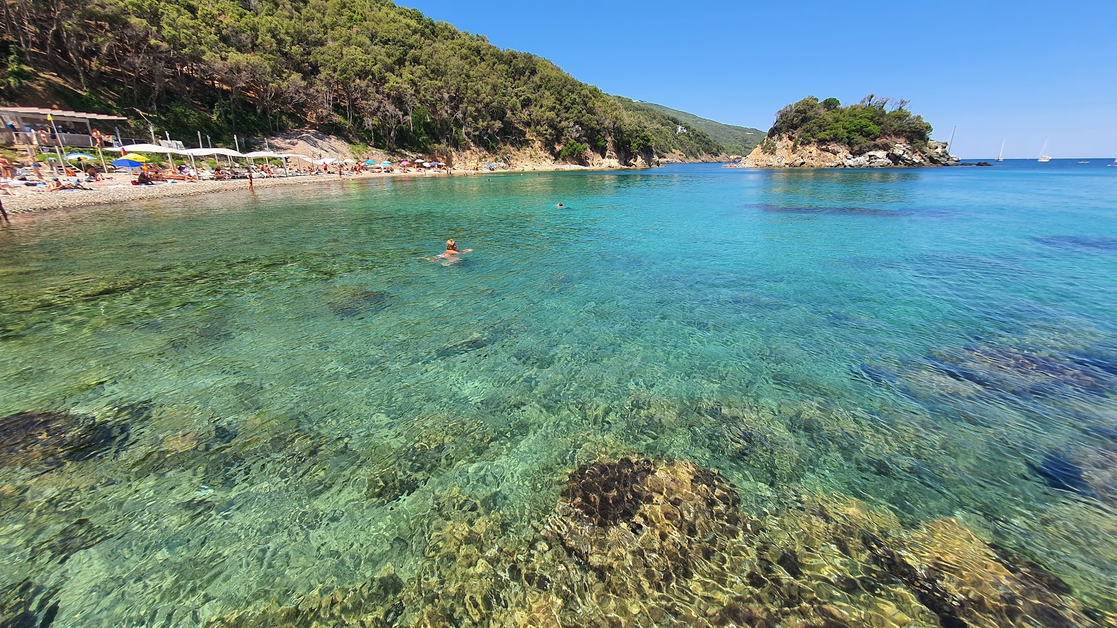 Foto van Spiaggia della Paolina met turquoise puur water oppervlakte
