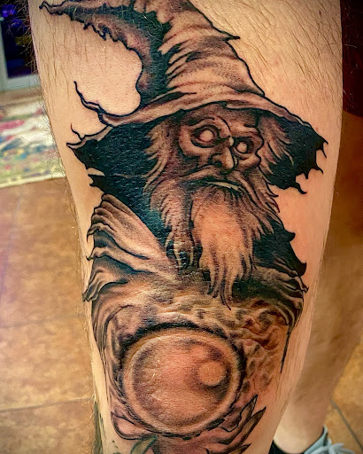 Explore leg tattoo ideas black male, creative tattoo ideas in Osage Beach, available at Rabbits Foot Tattoo Parlor