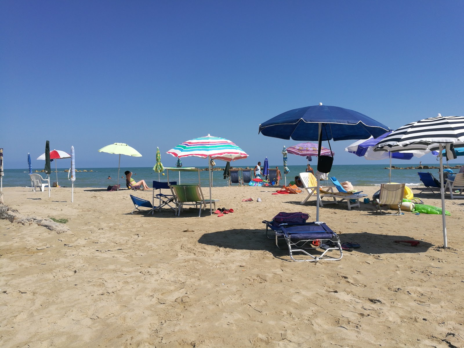 Foto van Spiaggia di Vallona en de nederzetting