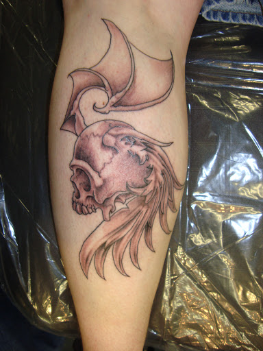 Explore mockingbird tattoo ideas, creative tattoo ideas in Foley, available at Black Sheep Custom Tattoos and Piercings
