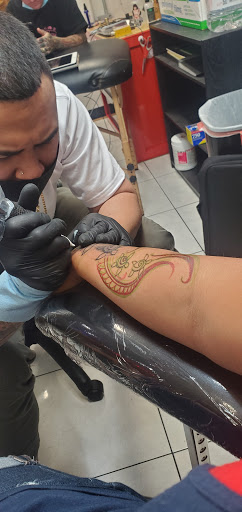 Explore deadpool tattoo ideas, creative tattoo ideas in Honolulu, available at Sacred Art Tattoo Waikiki