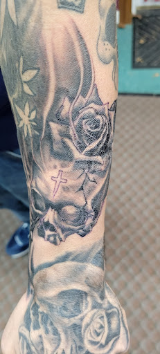 Explore religious tattoo ideas for women, creative tattoo ideas in Angola, available at Hoodlum Ink